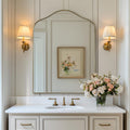 Brushed gold scalloped arched wall mirror
