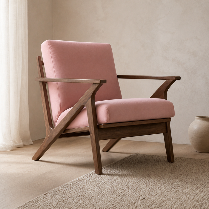 Zola mid-century accent chair in blush velvet and walnut, styled in a sunlit living room corner