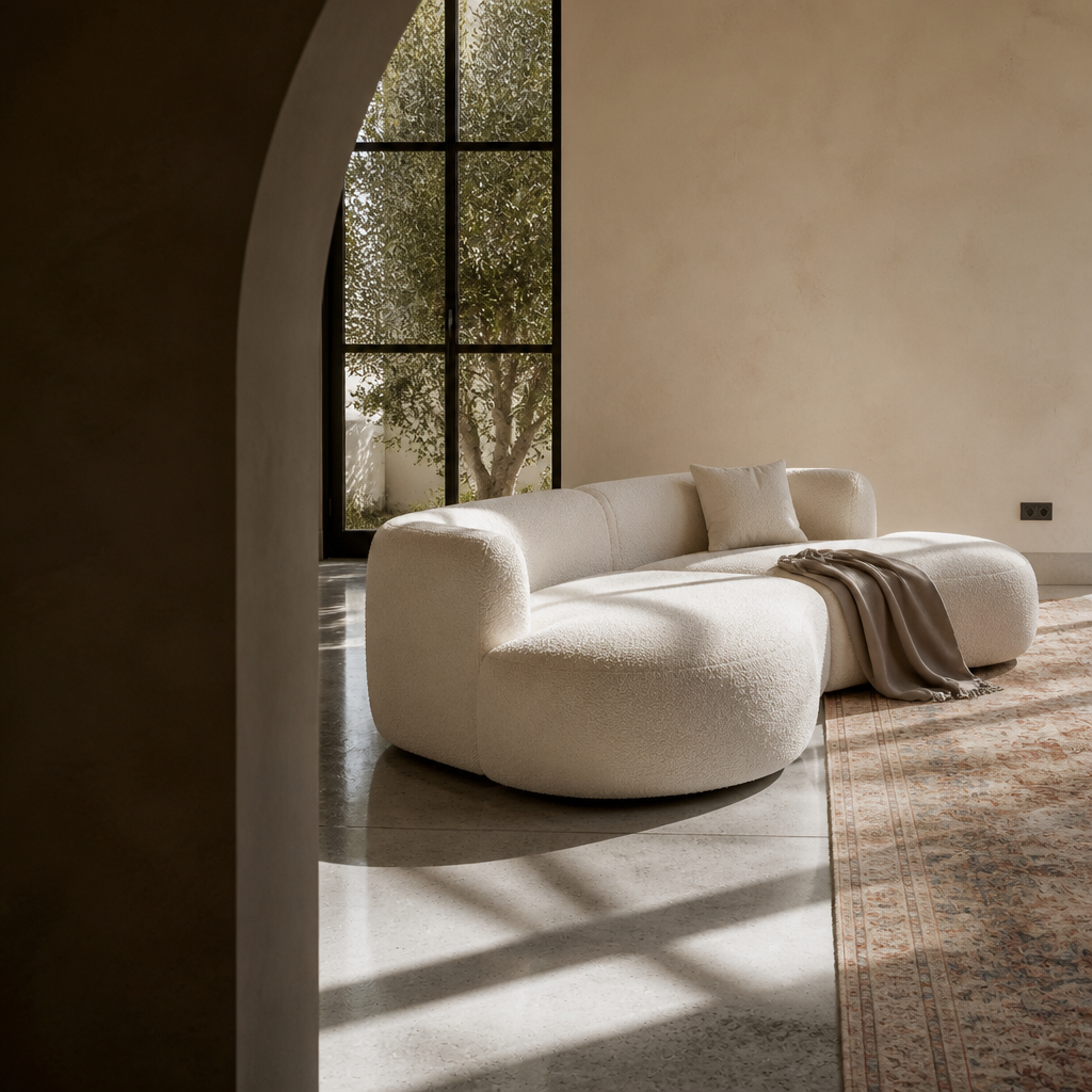 The Formia sectional seen through an arched opening showing its serpentine curve