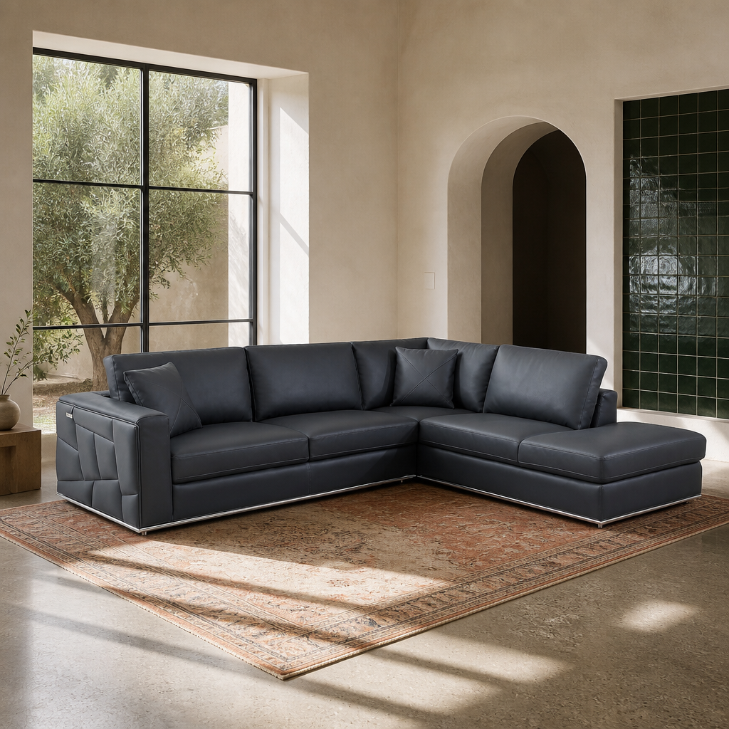 Surton charcoal leather sectional sofa shown in full in a sunlit modern living room