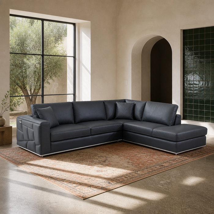 Surton charcoal leather sectional sofa shown in full in a sunlit modern living room
