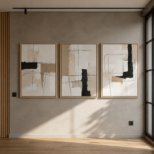 Set of three abstract minimalist canvas prints in pale solid wood floater frames hung in a row on a warm grey microcement wall