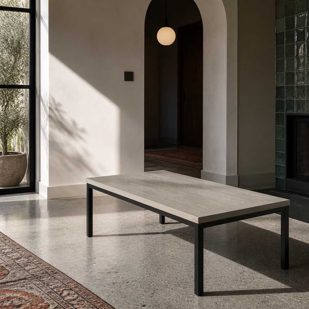 Three quarter view of the coffee table showing the black square section steel leg geometry
