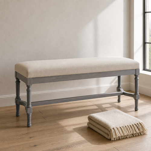 Grey-wash turned-leg upholstered bench, side product portrait against warm white plaster