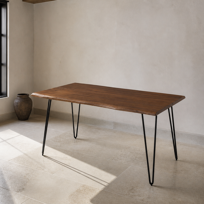 Ardor walnut live-edge dining table, front three-quarter product portrait in a chalk and limestone room