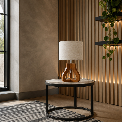 Wooden-based linen table lamp on a black floating shelf against a backlit white oak slat wall