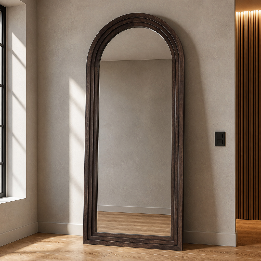 Arched farmhouse wood mirror, 71 by 32 inches, leaning against a microcement wall