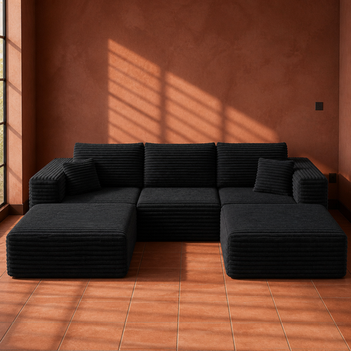 Black wide-wale corduroy U-shaped modular sectional sofa, 108 inches long, on a terracotta tile floor
