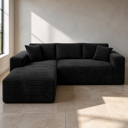 Black 2.5cm wale corduroy left facing chaise sectional, 96.9 inches wide, on a limestone flag floor