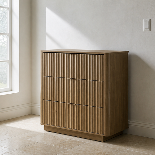 Three drawer fluted walnut dresser with handleless fronts against a chalk lime wash wall