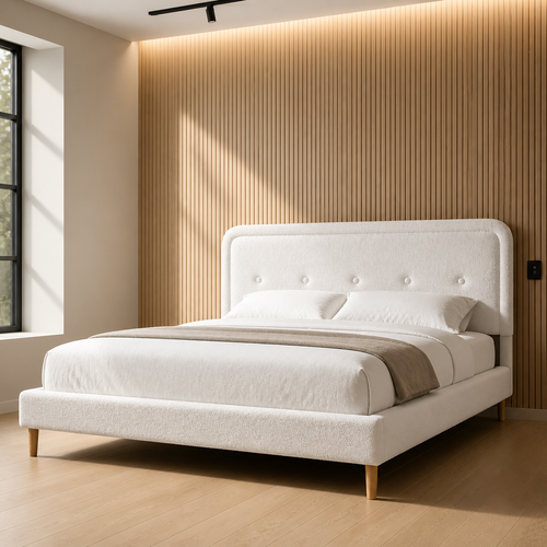White boucle king platform bed with curved button tufted headboard against a backlit oak slat wall