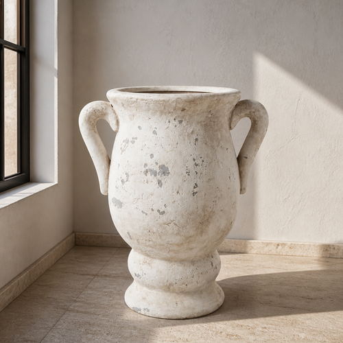 Ceramic Art Deco urn with two loop handles and distressed chalk white patina on travertine