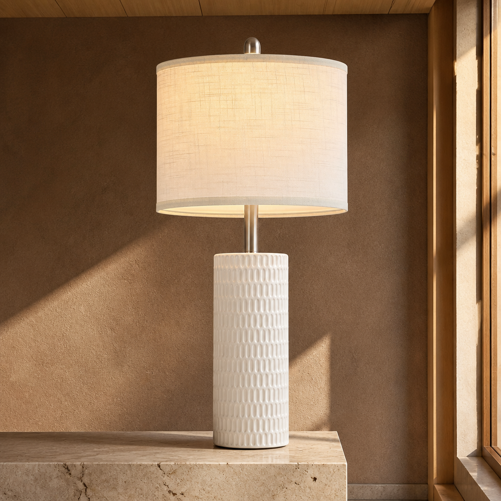 Ceramic farmhouse table lamp with carved textured white column and cream linen drum shade