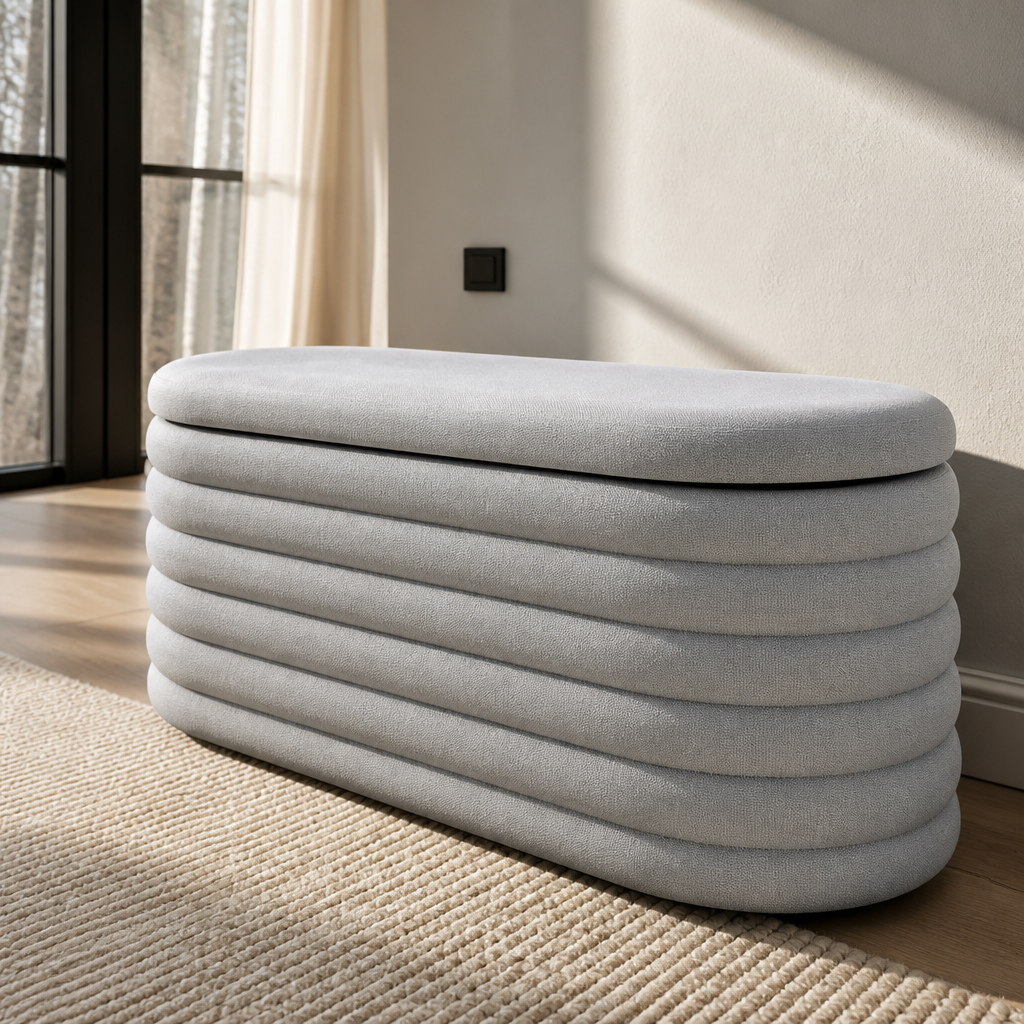 Macro detail of the light grey chenille pile and the horizontal channel tufting on the oval storage bench