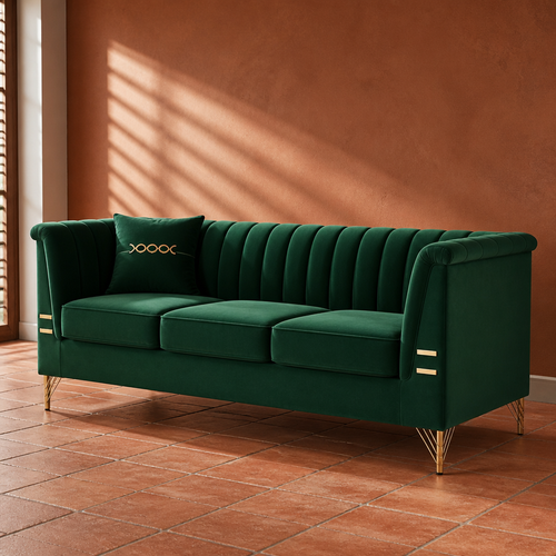 Emerald green velvet sofa with vertical channel tufted back and polished brass legs, 83 inches wide, against a rust clay plaster wall