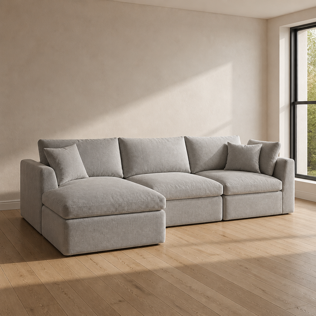 Pale greige chenille modular cloud sectional sofa with ottoman, front three quarter view