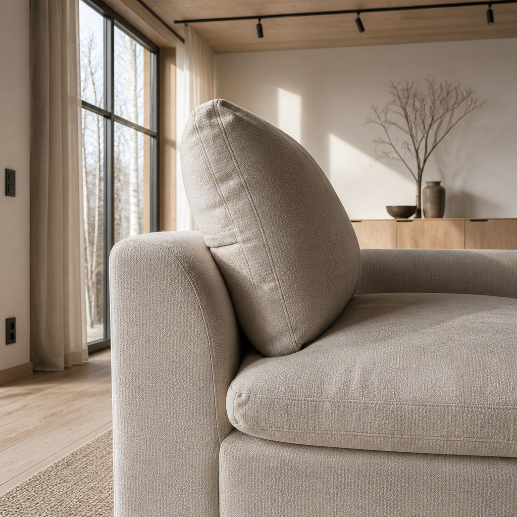 Close detail of the deep down filled cushions and rounded arm