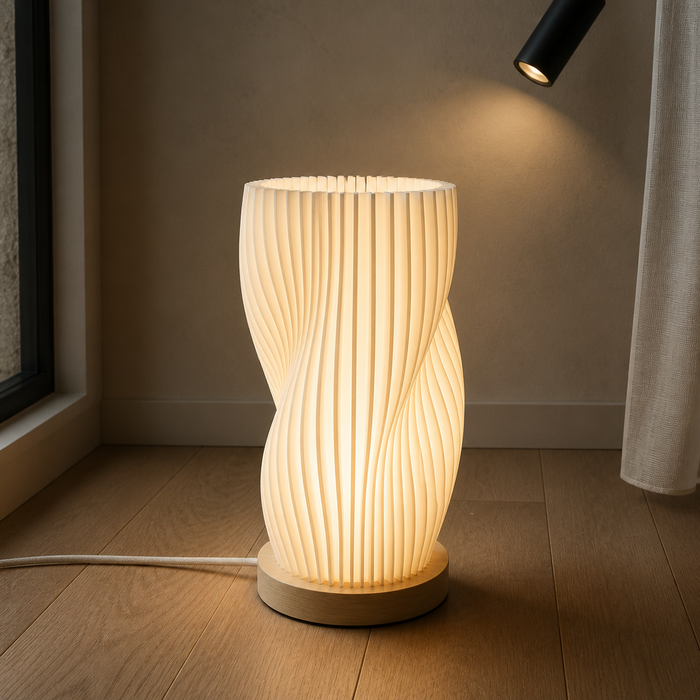 Pleated white table lamp on a pale wood base
