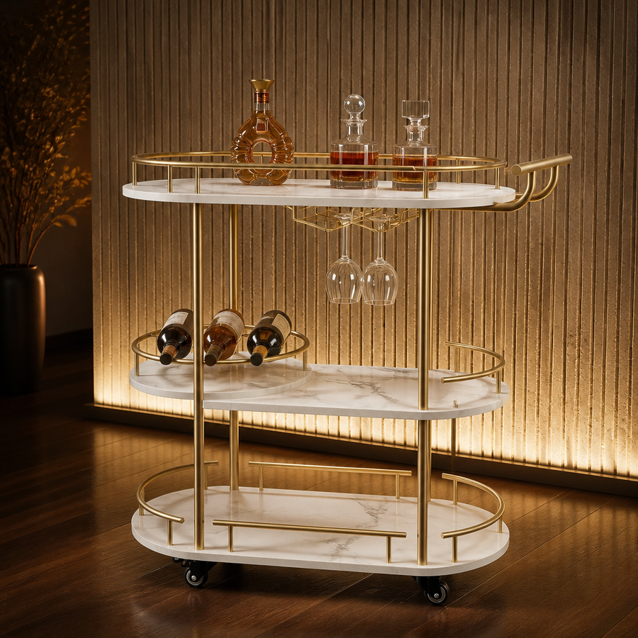 Gold and white marble three tier oval bar cart against a backlit stone wall