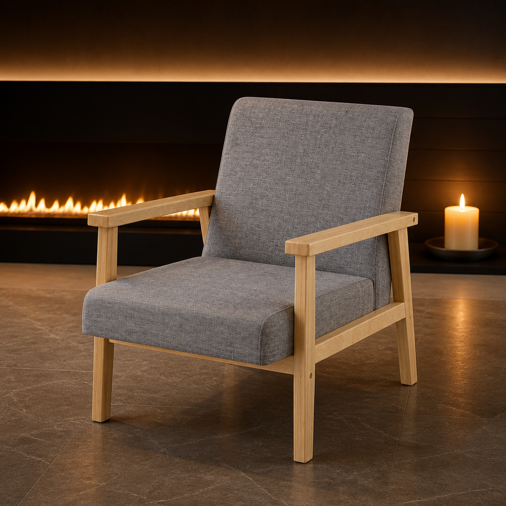 Grey linen accent chair with a pale natural wood frame in front of a linear fire