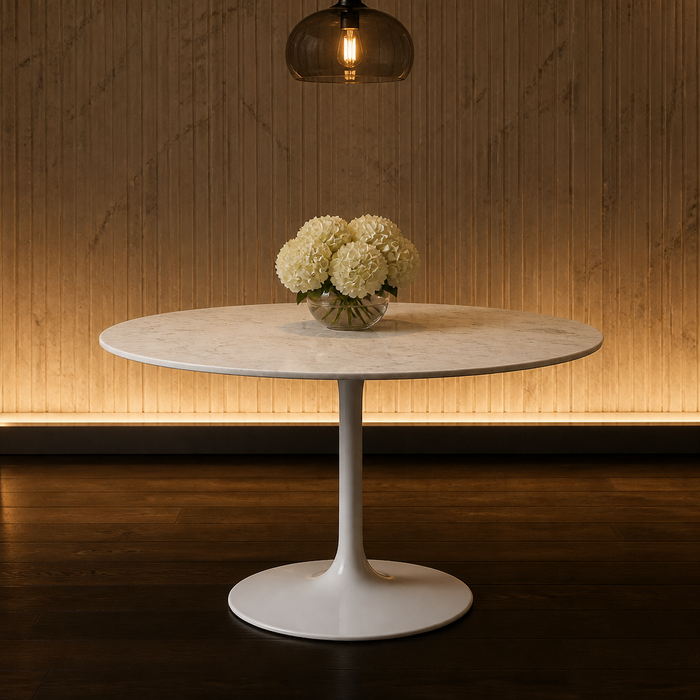 Round marble pedestal dining table with a white lacquered trumpet base