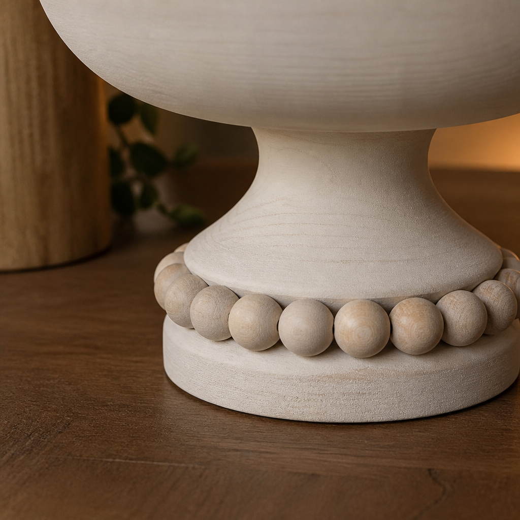 Detail of the pedestal stem, natural wood bead ring and disc foot of the white bowl