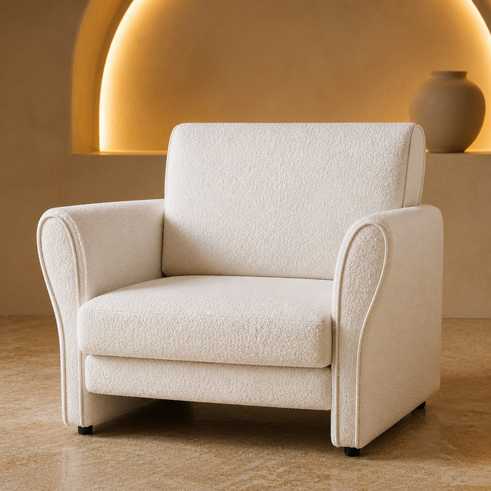 White boucle accent chair in a curved plaster niche