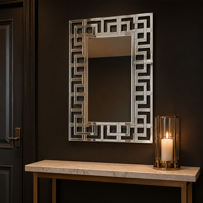 Silver geometric wall mirror in a dark opulent hallway