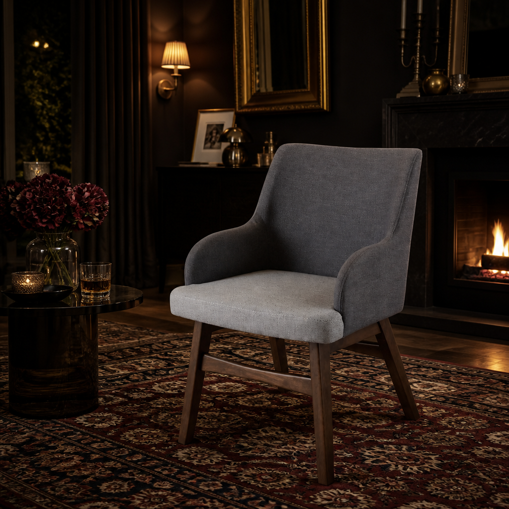 Grey fabric accent chair in dark living room