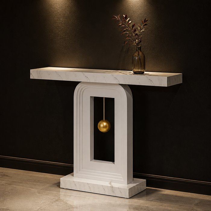 White faux-marble console with suspended gold sphere